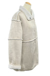Beige coat on a mannequin in a store setting