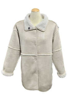  Beige coat on a mannequin in a store setting