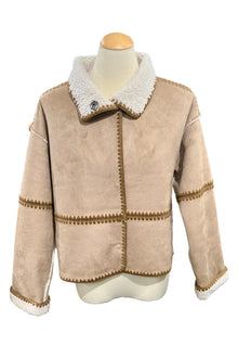  Beige jacket with white collar on a mannequin in a store setting