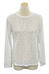 White long-sleeve shirt on a mannequin in a store setting