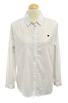 White shirt with a black heart on a mannequin in a store setting