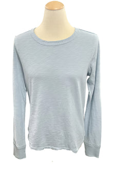  Light blue long-sleeve shirt on a mannequin in a store setting
