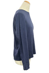 Navy blue long-sleeve shirt on a mannequin in a store setting