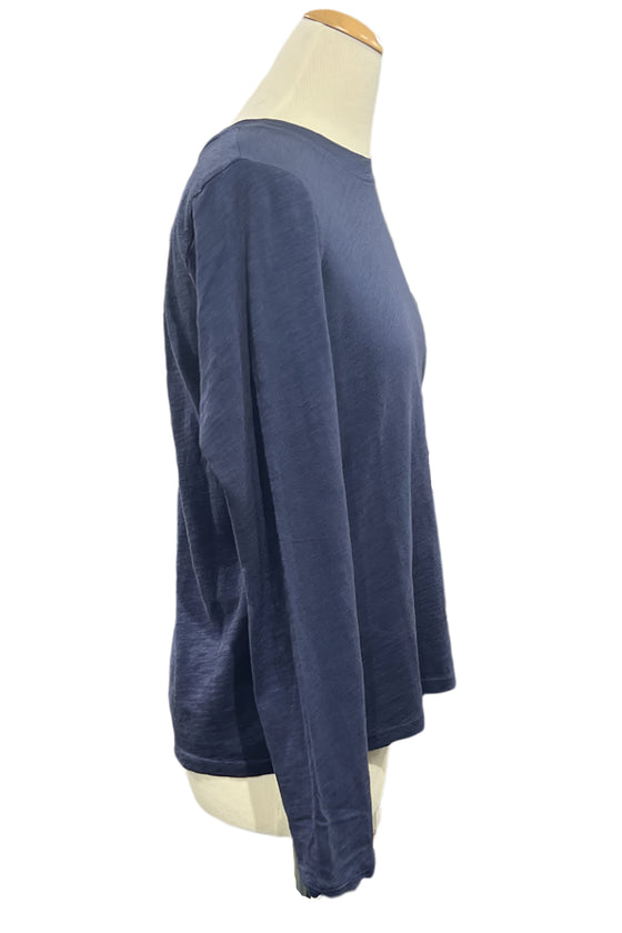 Navy blue long-sleeve shirt on a mannequin in a store setting