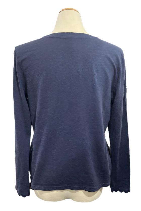 Navy blue long-sleeve shirt on a mannequin in a store setting