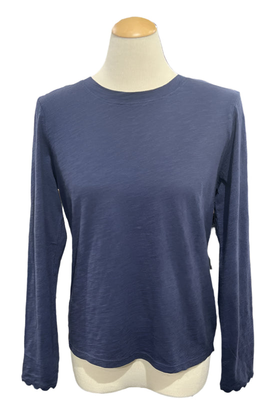 Navy blue long-sleeve shirt on a mannequin in a store setting