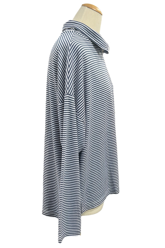 Striped shirt on a mannequin in a clothing store setting