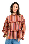 Woman wearing a striped blouse with ruffled details on a white background