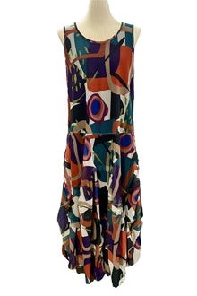  Colorful abstract patterned dress on a mannequin against a white background