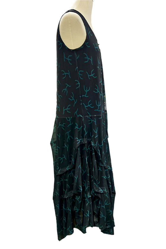 Black dress with blue patterns on a mannequin against a white background