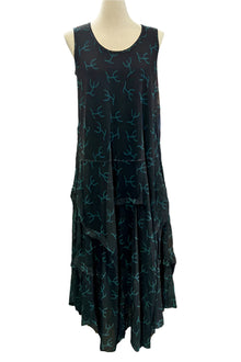  Black sleeveless dress with blue patterns on a mannequin against a white background