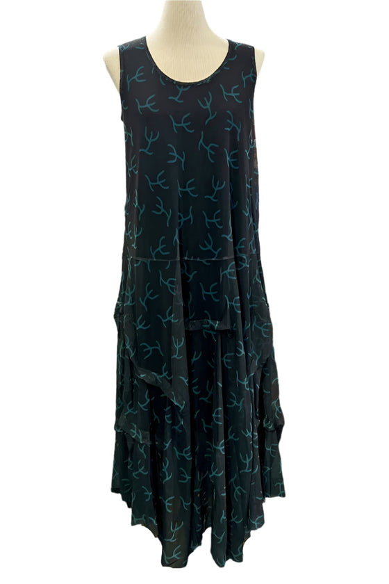 Black sleeveless dress with blue patterns on a mannequin against a white background