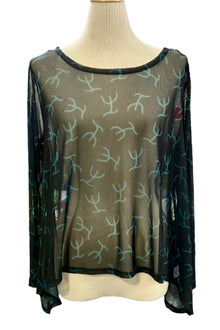  Sheer blouse with a pattern on a mannequin against a white background