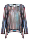 Sheer blouse with multicolor abstract pattern on a white background