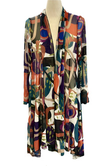  Colorful patterned dress on a mannequin in a workshop setting