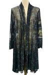 Black sheer cardigan with white floral pattern on a mannequin against a blurred outdoor background