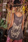 Person wearing a tank top with a butterfly design and floral background