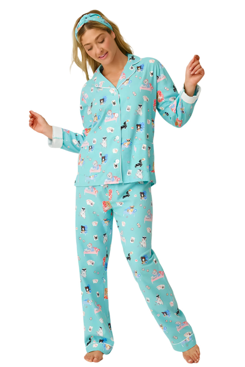  Woman wearing a blue pajama set with animal print on a white background