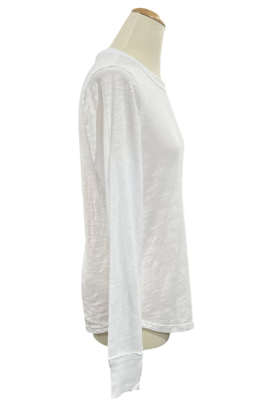 White long-sleeve shirt on a mannequin in a store setting