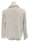 Beige fleece jacket on a mannequin in a store setting