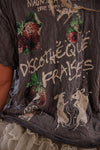 T-shirt with artistic designs and text on a dark background