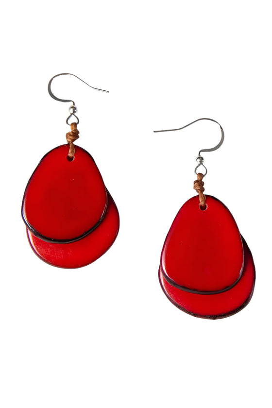 Red teardrop-shaped earrings on a white background