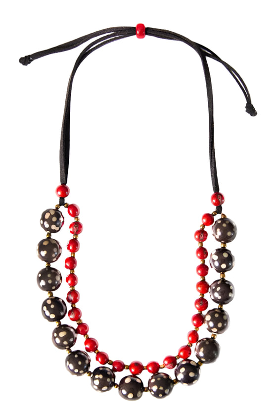 Necklace with red and black beads on a white background