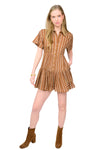 Woman wearing a brown patterned romper with short sleeves on a white background