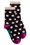 Pair of socks with owl pattern on a light gray background