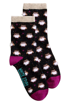  Pair of socks with owl pattern on a light gray background