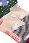 Set of colorful socks with sheep design and 'White Stuff' text on a neutral background