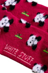 Red sock with panda pattern and 'White Stuff' branding on a beige surface