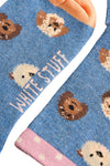 Blue socks with hedgehog pattern and 'White Stuff' branding on a light background