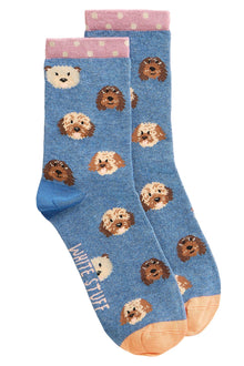  Blue socks with dog patterns on a light gray background