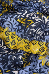 Close-up of patterned fabric with yellow and blue design