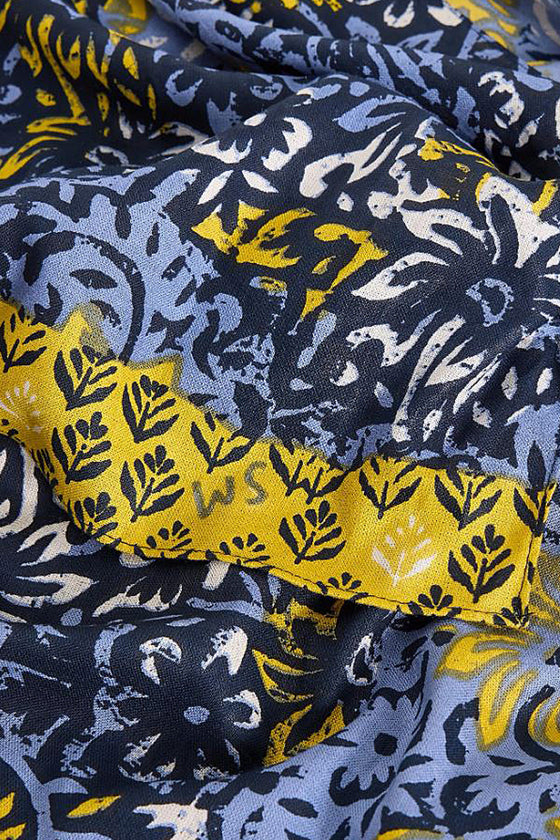 Close-up of patterned fabric with yellow and blue design
