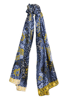  Blue and yellow patterned scarf on a light gray background